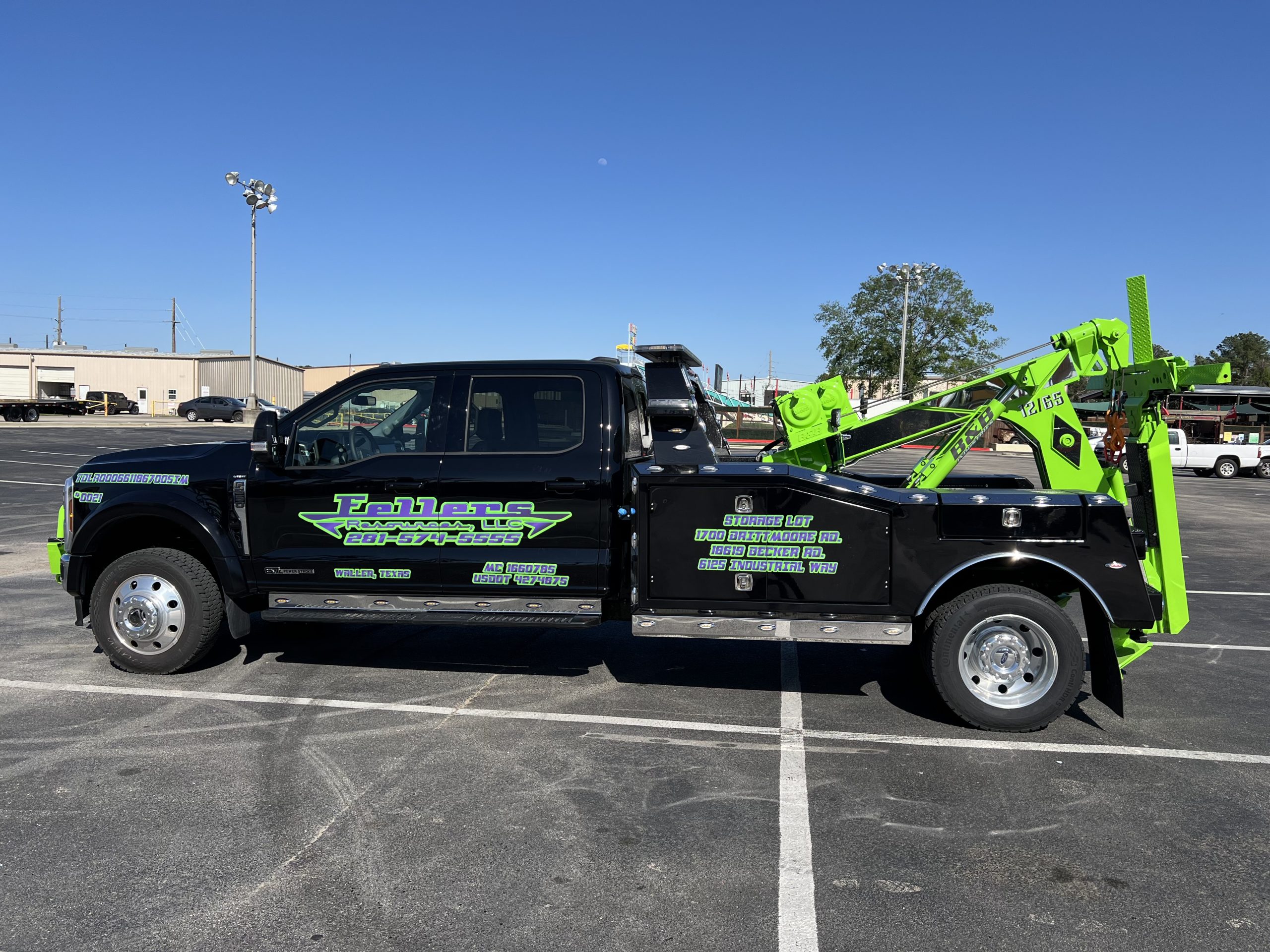 Fellers Recovery black and lime commercial tow truck graphics